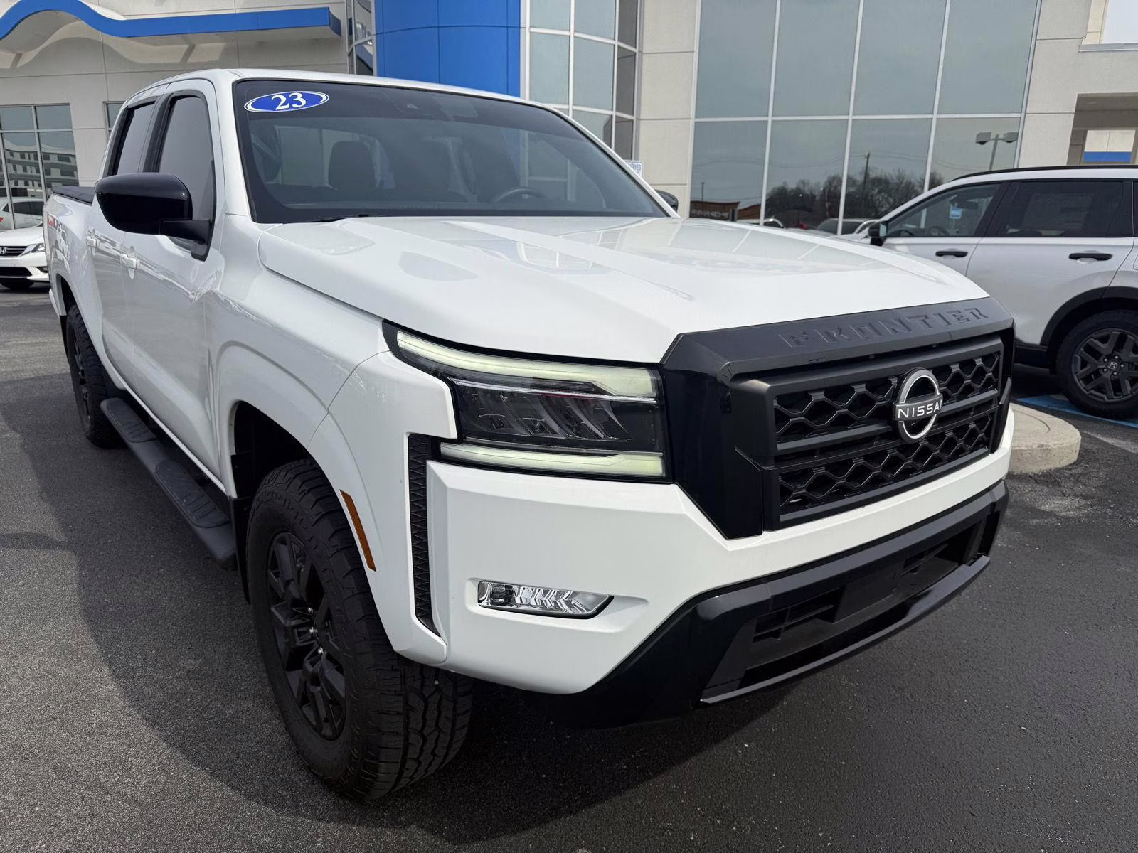 2023 Glacier White Nissan Frontier SV 4X4 Truck