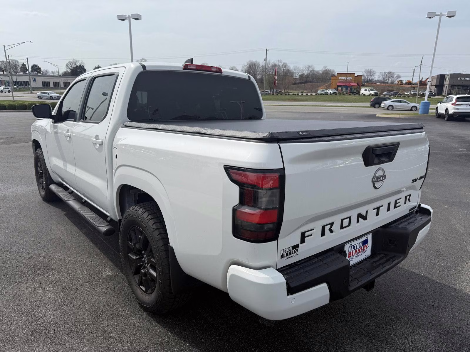 2023 Glacier White Nissan Frontier SV 4X4 Truck