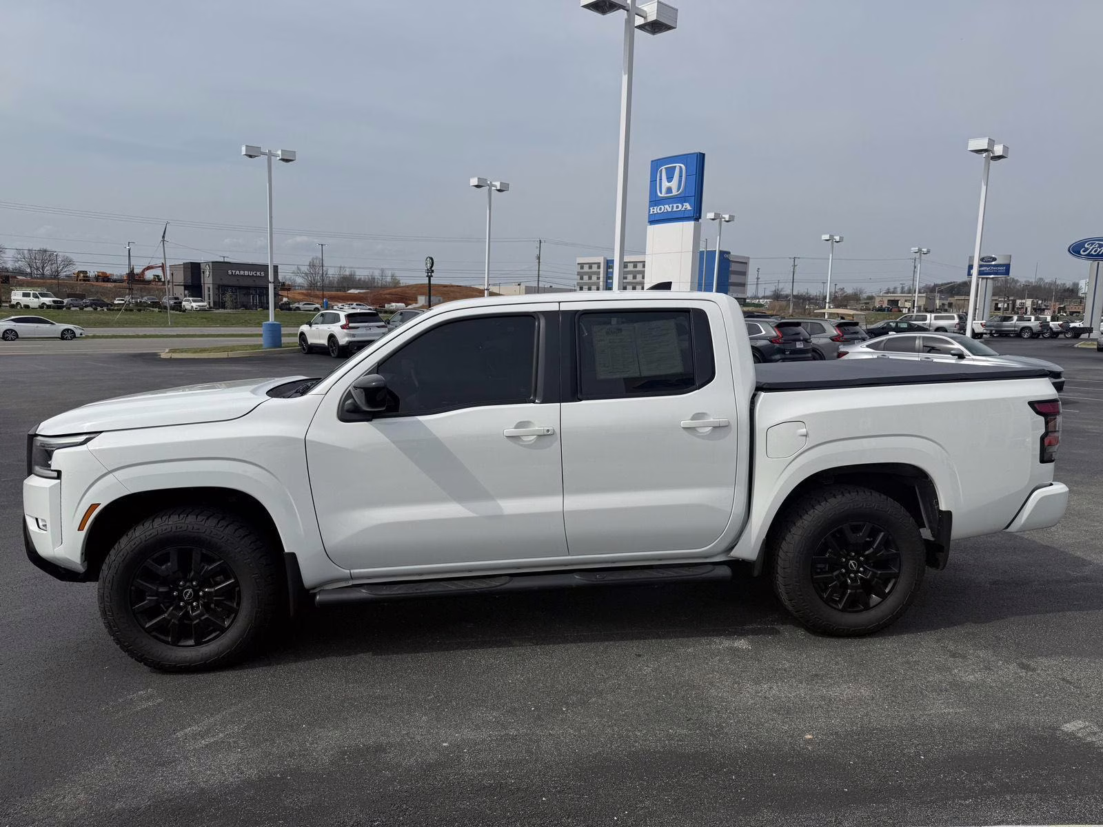 2023 Glacier White Nissan Frontier SV 4X4 Truck