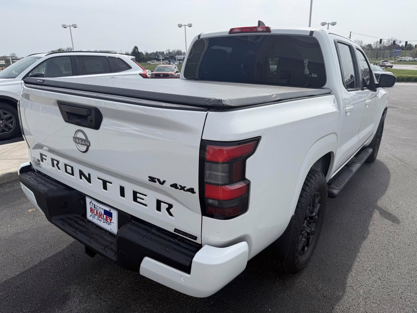 2023 Glacier White Nissan Frontier SV 4X4 Truck
