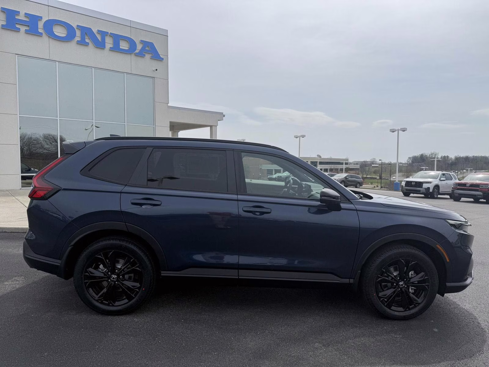 2026 Canyon River Blue Metallic Honda CR-V Hybrid Sport Touring AWD SUV
