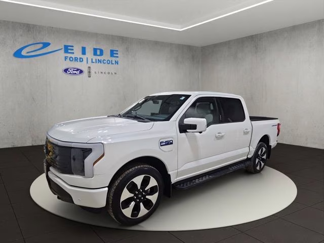 2024 Star White Metallic Tri-Coat Ford F-150 Lightning Platinum AWD Truck