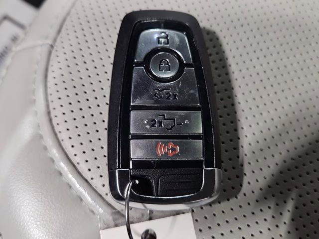 2024 Star White Metallic Tri-Coat Ford F-150 Lightning Platinum AWD Truck