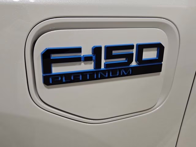 2024 Star White Metallic Tri-Coat Ford F-150 Lightning Platinum AWD Truck