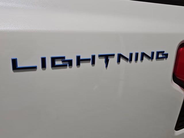 2024 Star White Metallic Tri-Coat Ford F-150 Lightning Platinum AWD Truck