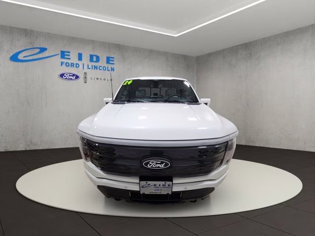 2024 Star White Metallic Tri-Coat Ford F-150 Lightning Platinum AWD Truck