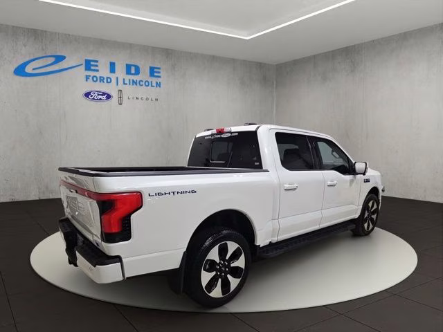 2024 Star White Metallic Tri-Coat Ford F-150 Lightning Platinum AWD Truck
