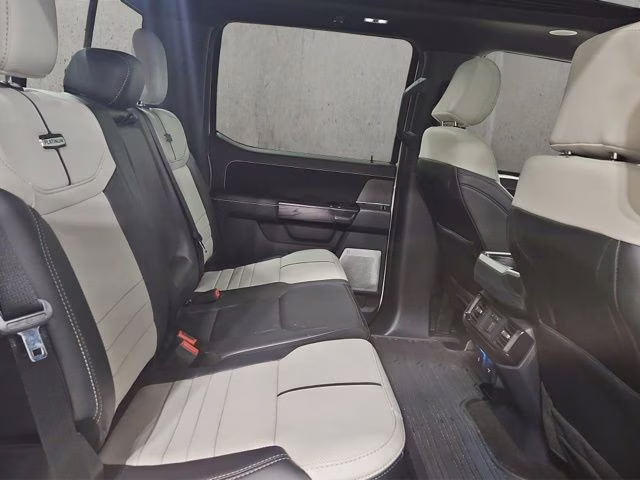 2024 Star White Metallic Tri-Coat Ford F-150 Lightning Platinum AWD Truck