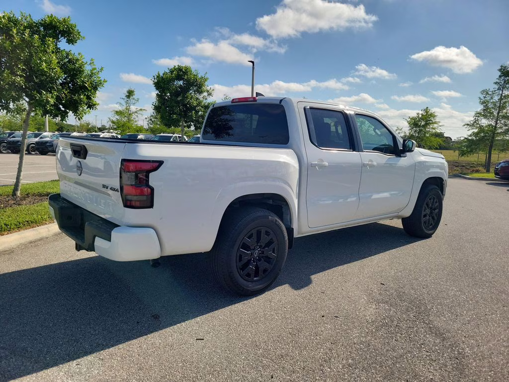 2023 Glacier White Nissan Frontier SV 4X4 Truck
