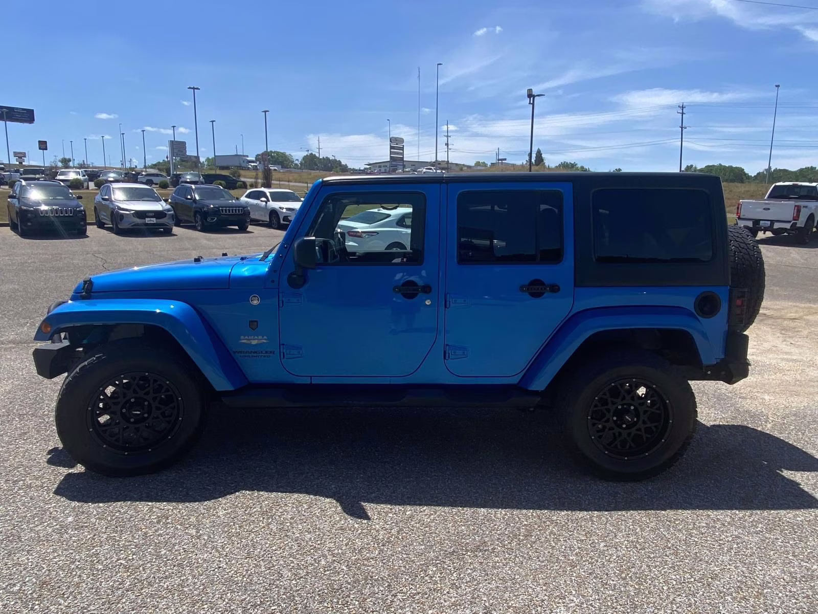 2015 Hydro Blue Pearl Coat Jeep Wrangler Unlimited Sahara 4X4 SUV