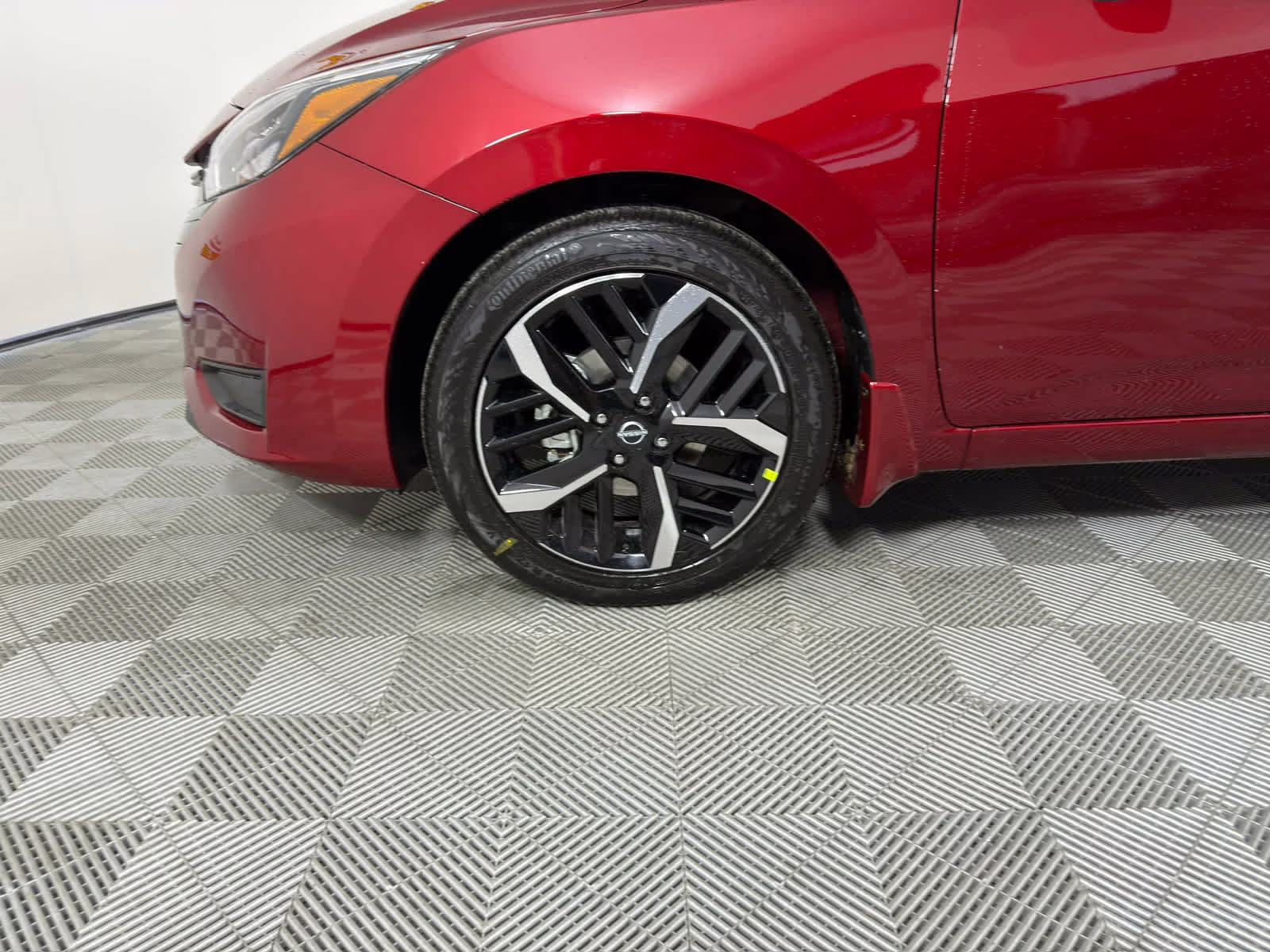 2025 Scarlet Ember Tintcoat Nissan Versa SR FWD Sedan