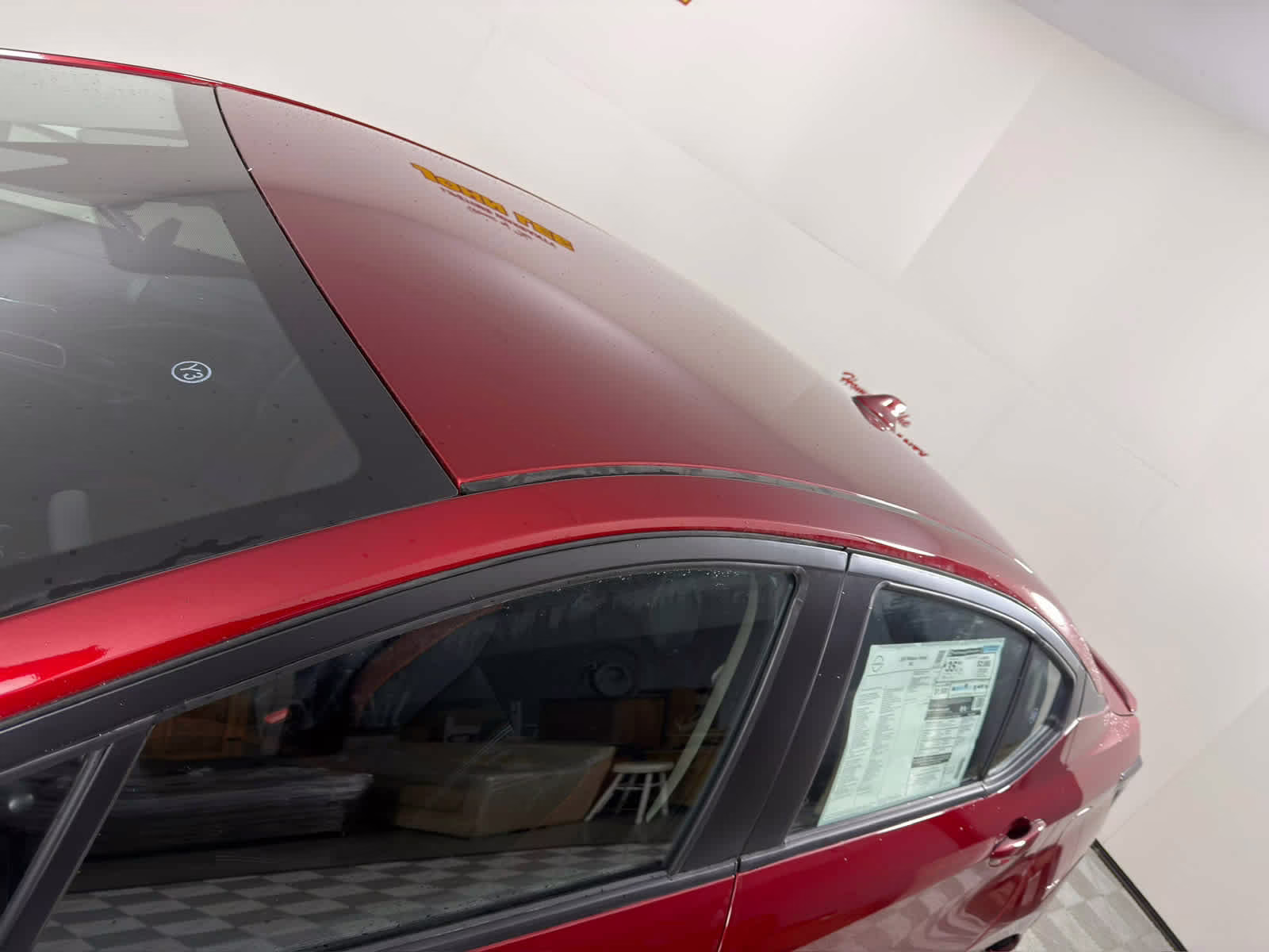 2025 Scarlet Ember Tintcoat Nissan Versa SR FWD Sedan