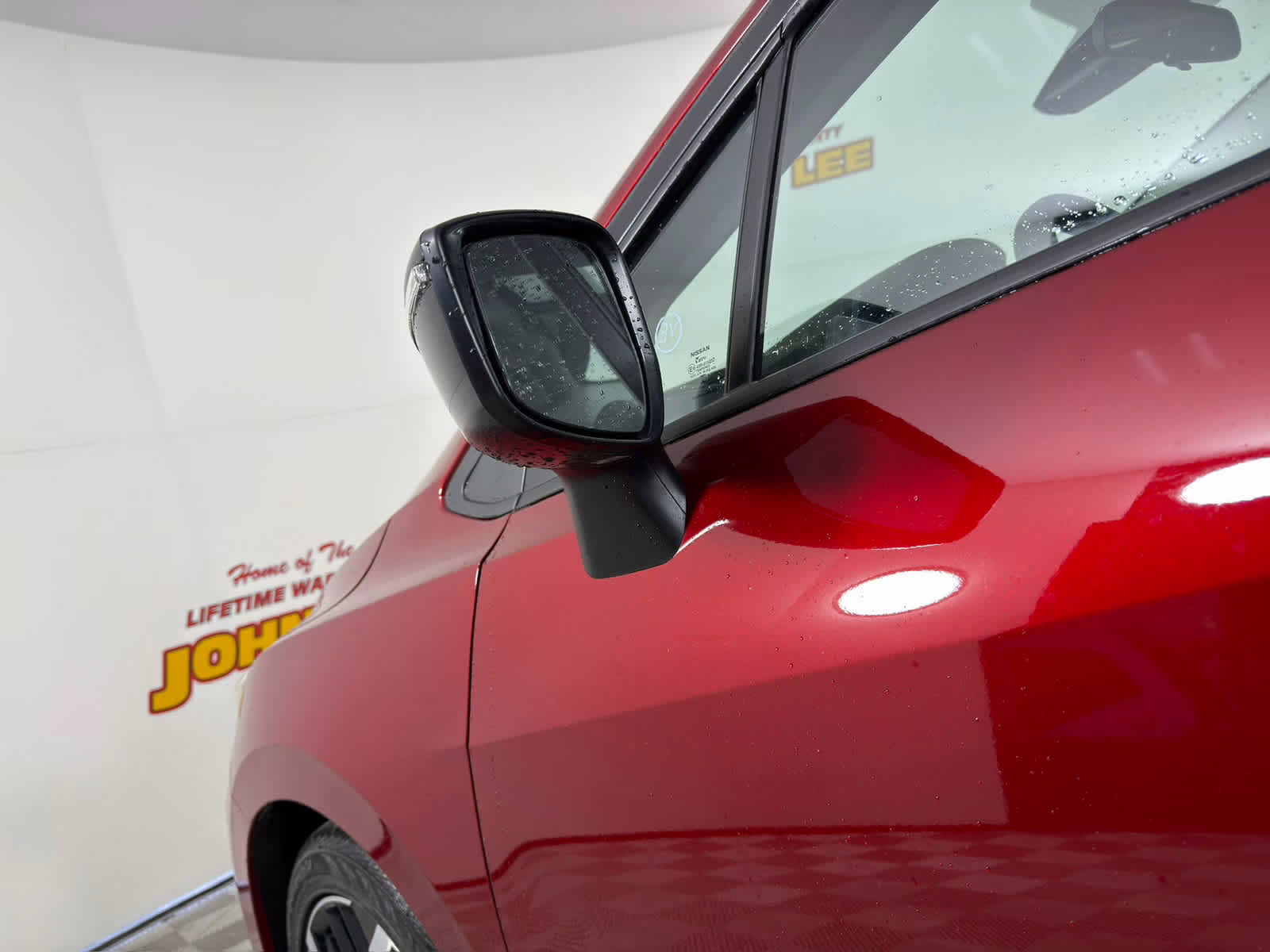 2025 Scarlet Ember Tintcoat Nissan Versa SR FWD Sedan