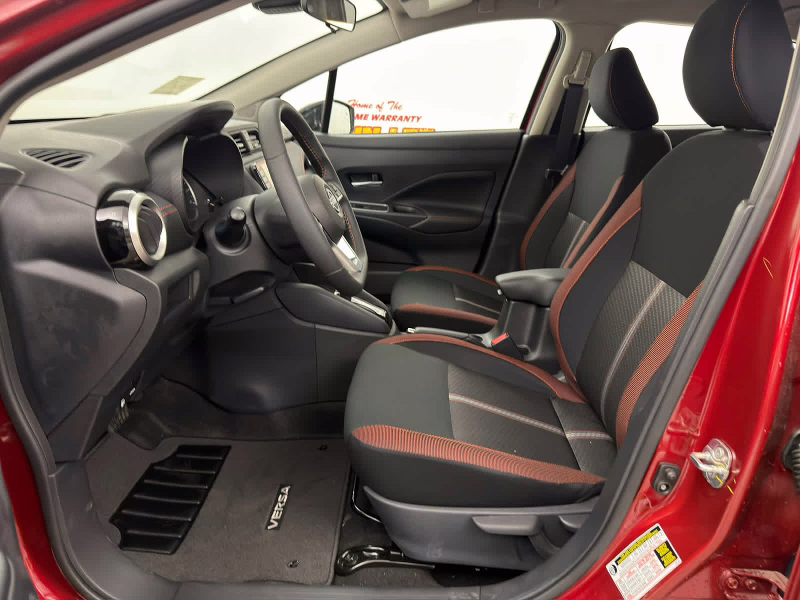2025 Scarlet Ember Tintcoat Nissan Versa SR FWD Sedan