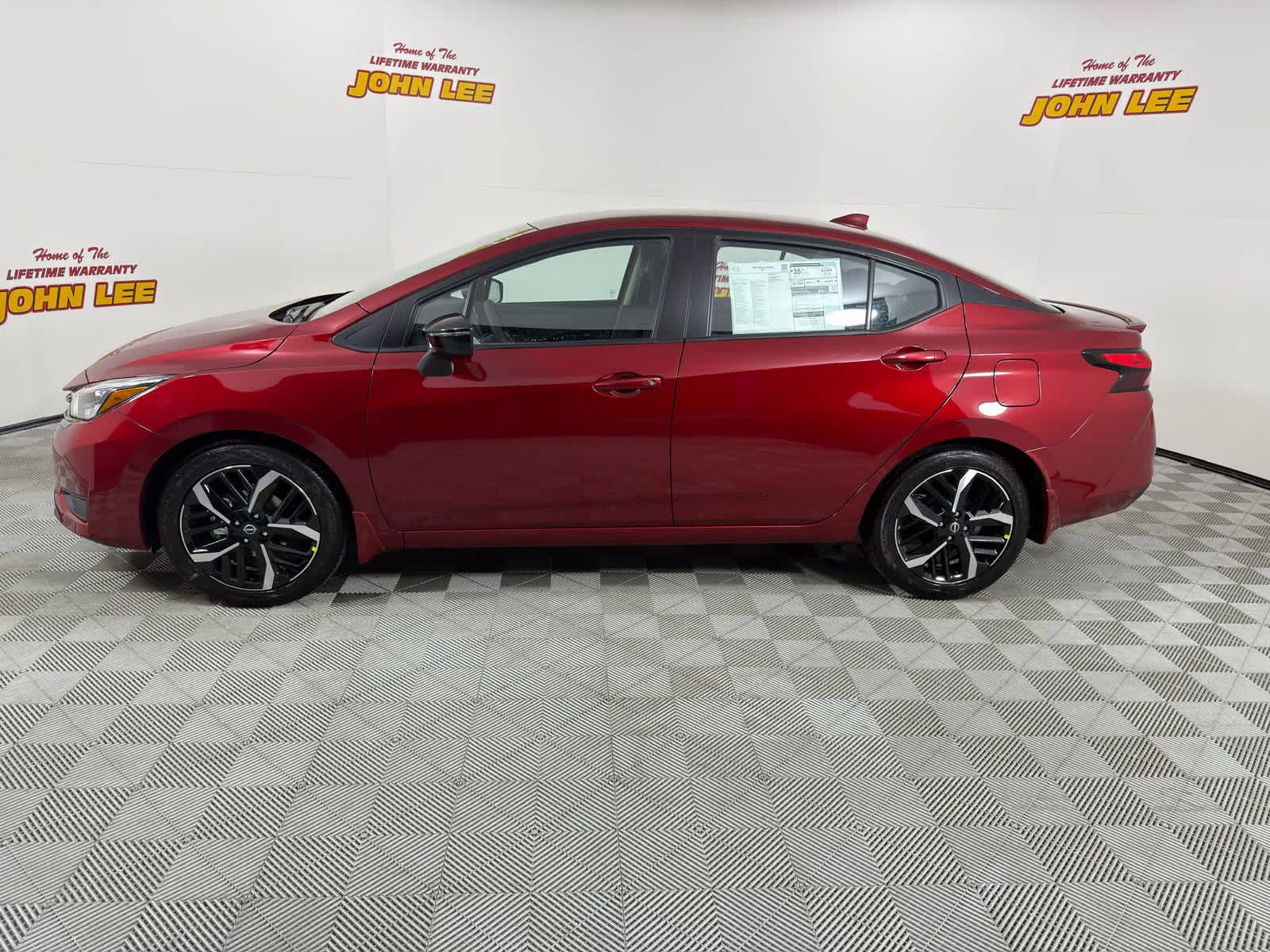 2025 Scarlet Ember Tintcoat Nissan Versa SR FWD Sedan