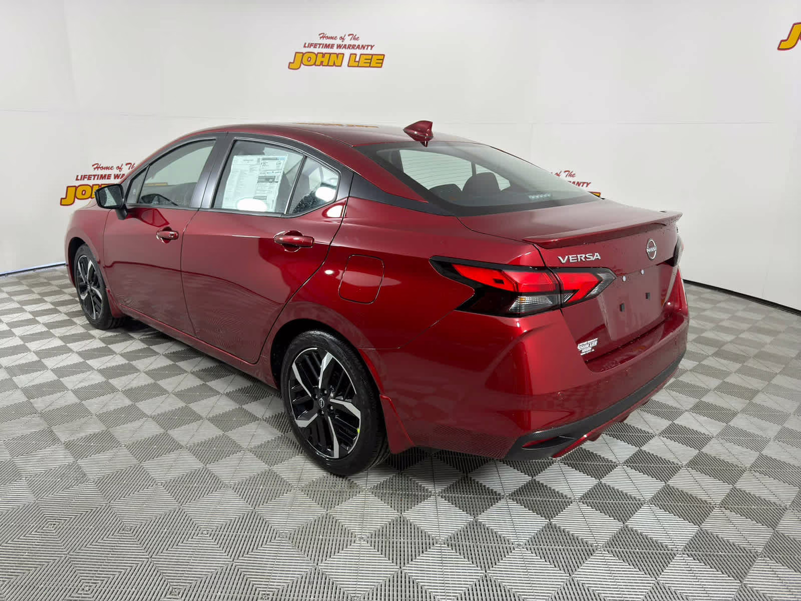 2025 Scarlet Ember Tintcoat Nissan Versa SR FWD Sedan