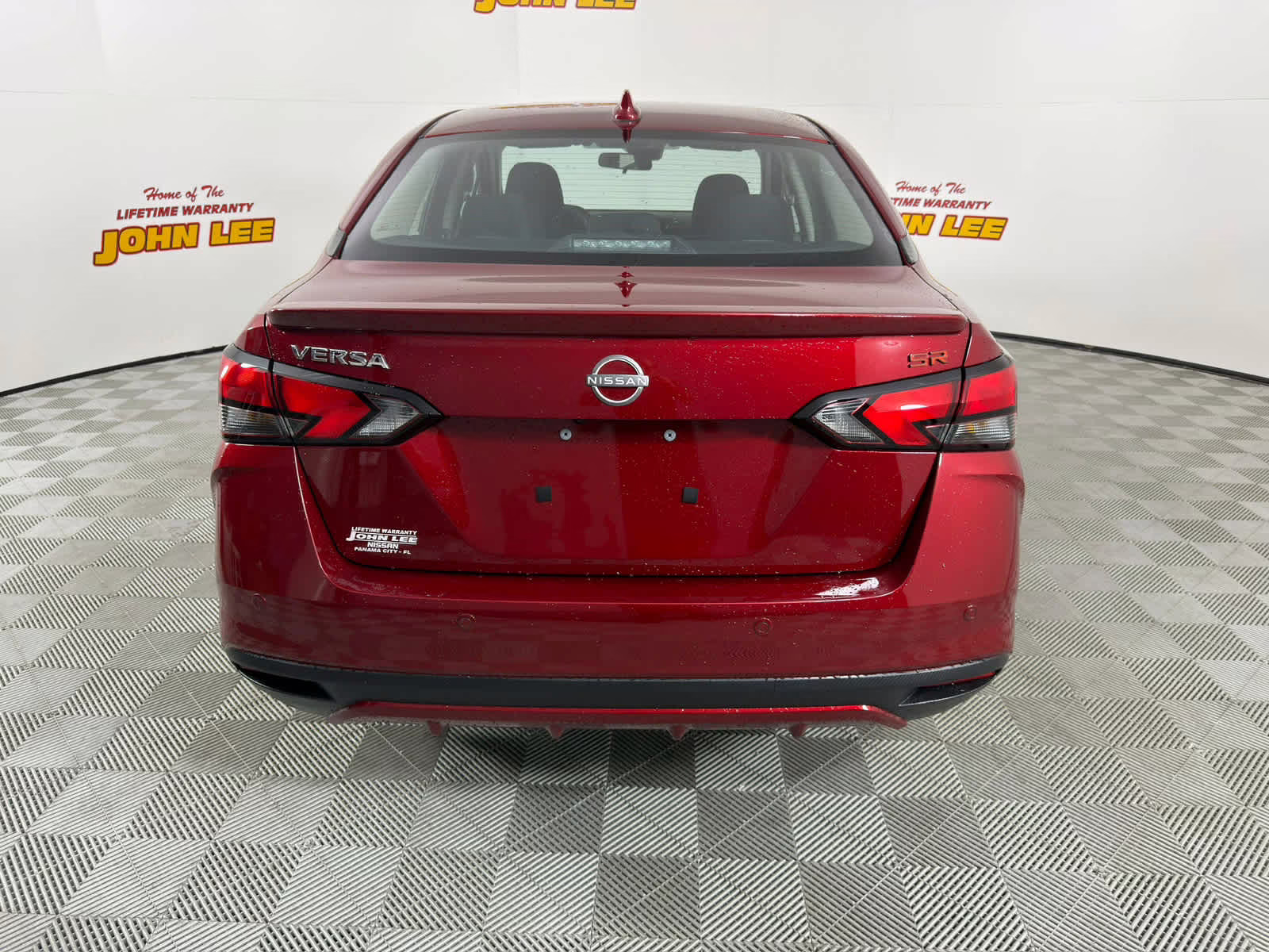 2025 Scarlet Ember Tintcoat Nissan Versa SR FWD Sedan