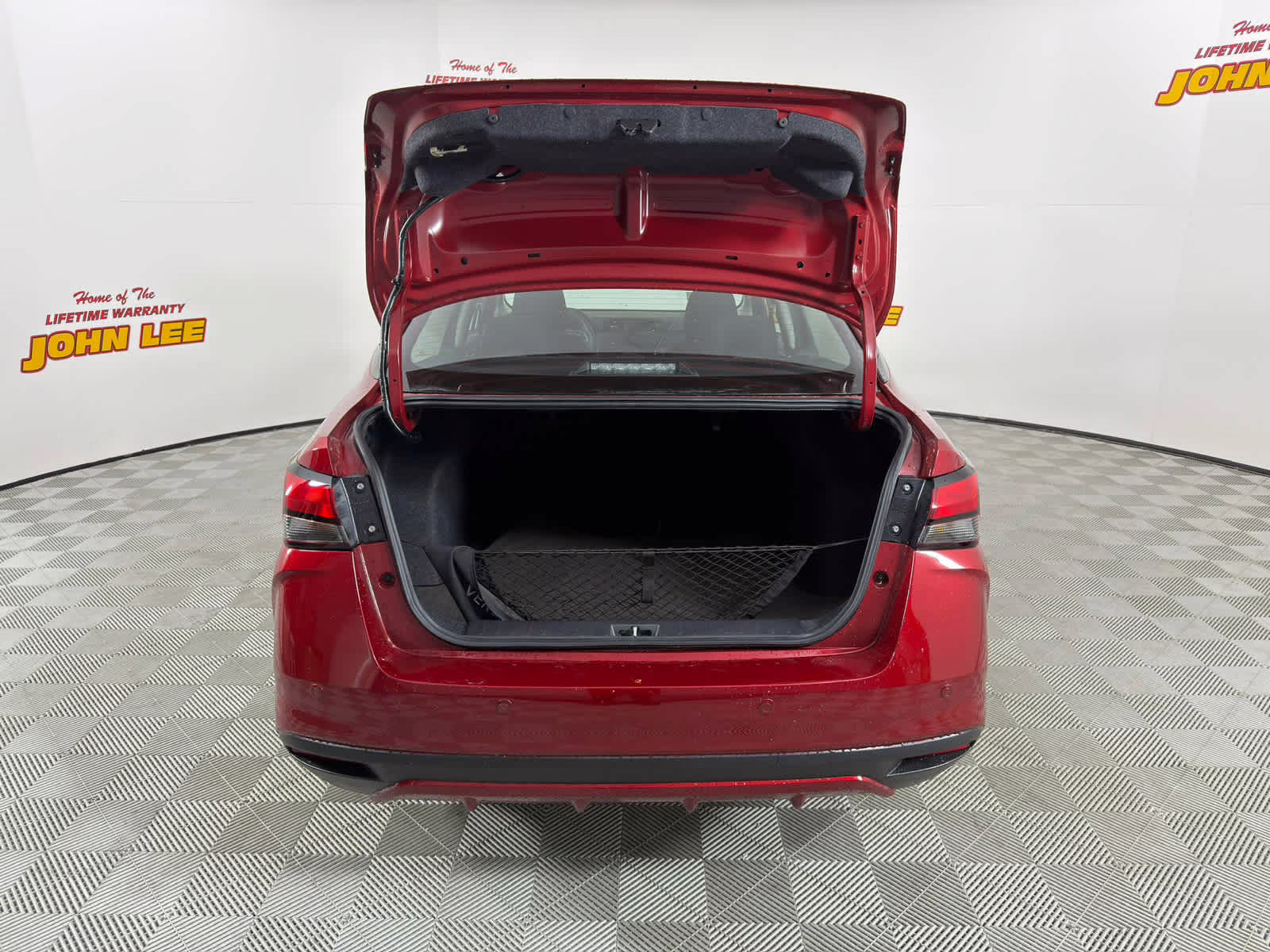 2025 Scarlet Ember Tintcoat Nissan Versa SR FWD Sedan