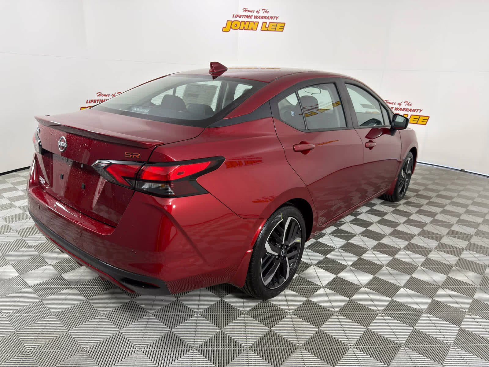 2025 Scarlet Ember Tintcoat Nissan Versa SR FWD Sedan