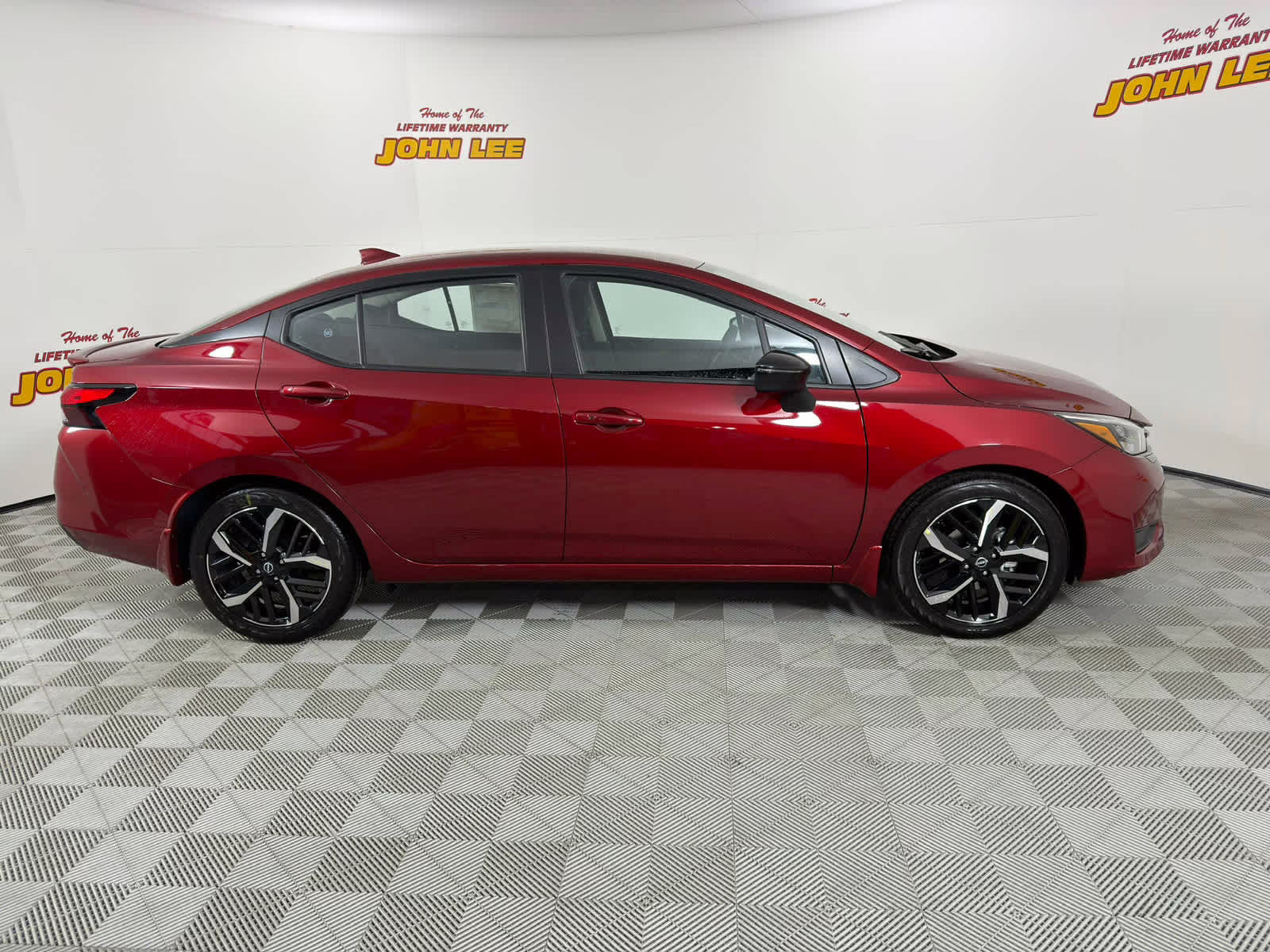 2025 Scarlet Ember Tintcoat Nissan Versa SR FWD Sedan