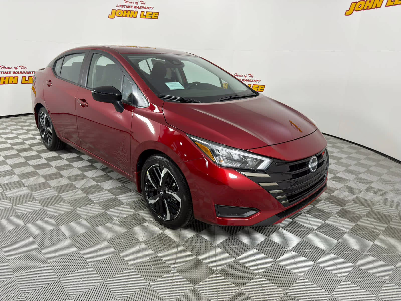 2025 Scarlet Ember Tintcoat Nissan Versa SR FWD Sedan