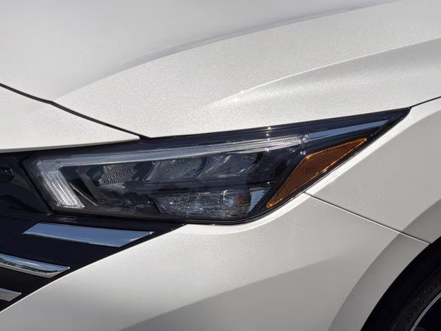 2025 Aspen White Tricoat Nissan Versa 1.6 SV FWD Sedan