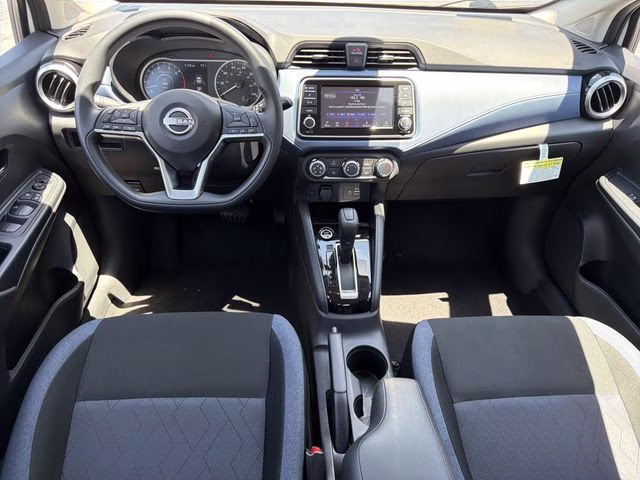 2025 Aspen White Tricoat Nissan Versa 1.6 SV FWD Sedan