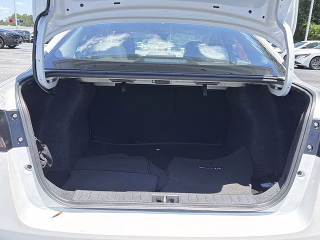 2025 Aspen White Tricoat Nissan Versa 1.6 SV FWD Sedan