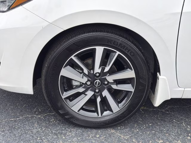 2025 Aspen White Tricoat Nissan Versa 1.6 SV FWD Sedan
