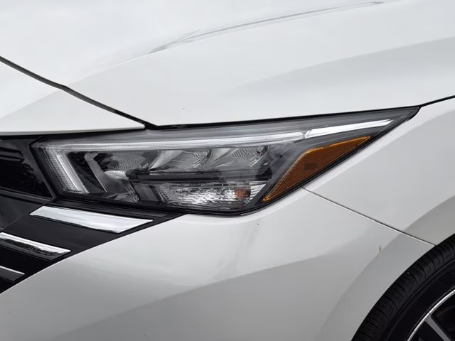 2025 Aspen White Tricoat Nissan Versa 1.6 SV FWD Sedan