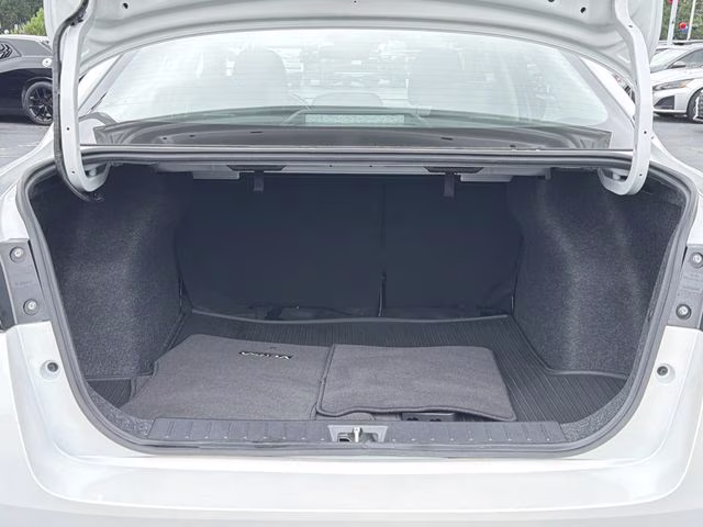 2025 Aspen White Tricoat Nissan Versa 1.6 SV FWD Sedan