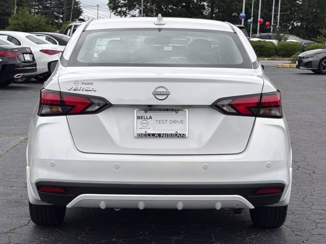 2025 Aspen White Tricoat Nissan Versa 1.6 SV FWD Sedan