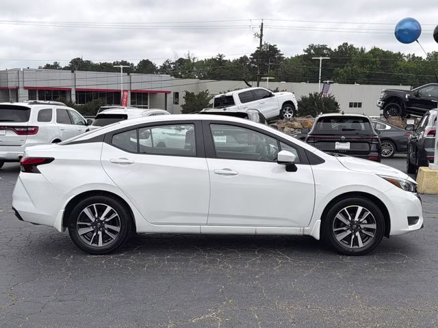 2025 Aspen White Tricoat Nissan Versa 1.6 SV FWD Sedan