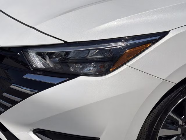 2025 Aspen White Tricoat Nissan Versa 1.6 SV FWD Sedan