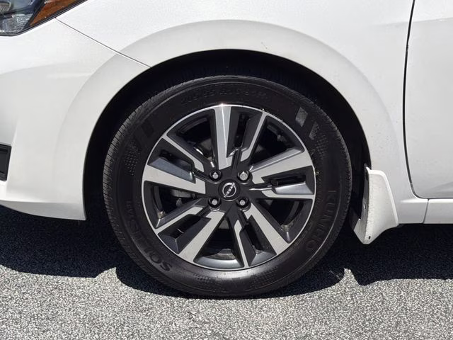 2025 Aspen White Tricoat Nissan Versa 1.6 SV FWD Sedan
