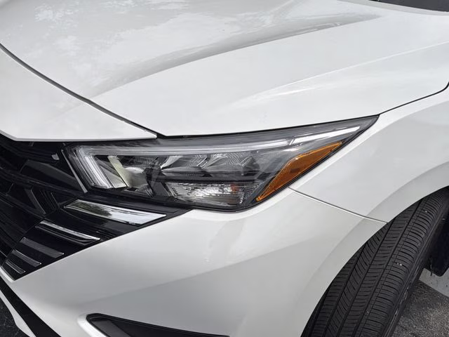 2025 Aspen White Tricoat Nissan Versa 1.6 SV FWD Sedan