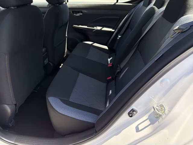 2025 Aspen White Tricoat Nissan Versa 1.6 SV FWD Sedan