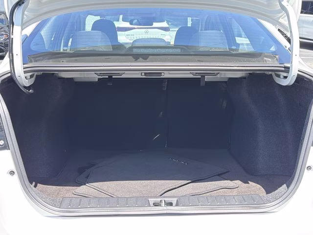2025 Aspen White Tricoat Nissan Versa 1.6 SV FWD Sedan