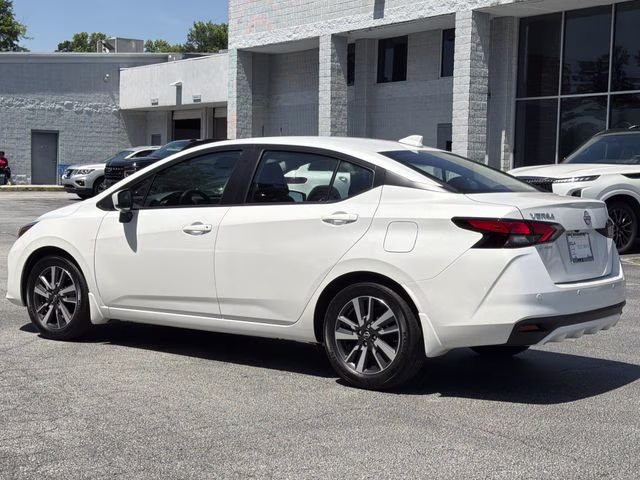 2025 Aspen White Tricoat Nissan Versa 1.6 SV FWD Sedan