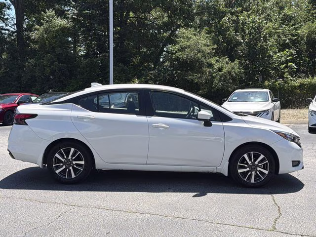 2025 Aspen White Tricoat Nissan Versa 1.6 SV FWD Sedan