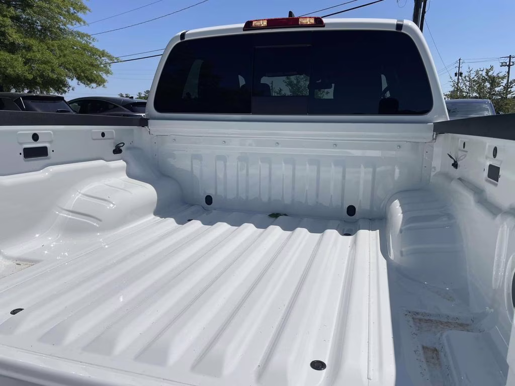 2026 Glacier White Nissan Frontier SV 4X4 Truck