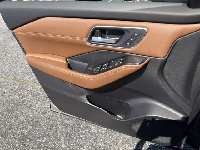 2025 Champagne Silver Metallic/Super Black Nissan Rogue Platinum FWD SUV