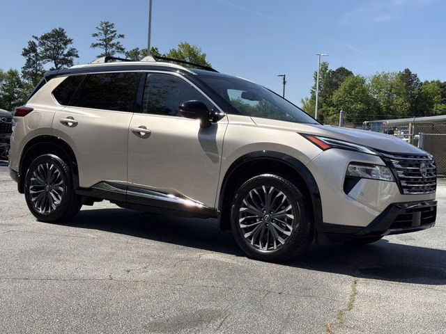 2025 Champagne Silver Metallic/Super Black Nissan Rogue Platinum FWD SUV