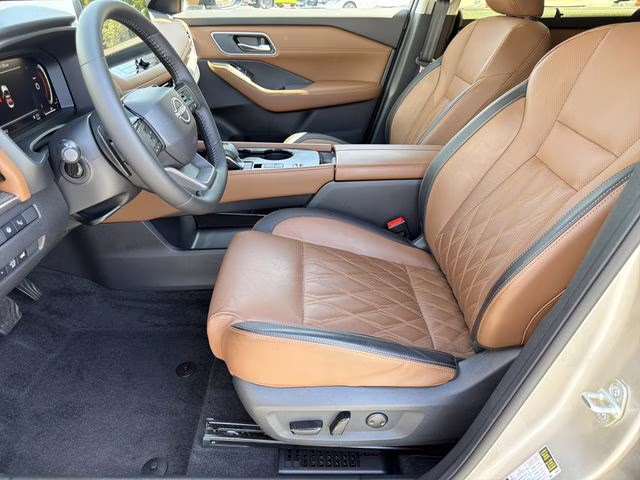 2025 Champagne Silver Metallic/Super Black Nissan Rogue Platinum FWD SUV