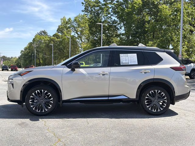 2025 Champagne Silver Metallic/Super Black Nissan Rogue Platinum FWD SUV