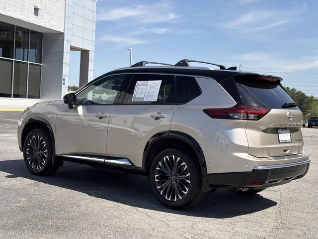 2025 Champagne Silver Metallic/Super Black Nissan Rogue Platinum FWD SUV
