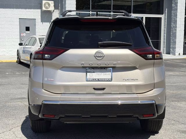 2025 Champagne Silver Metallic/Super Black Nissan Rogue Platinum FWD SUV