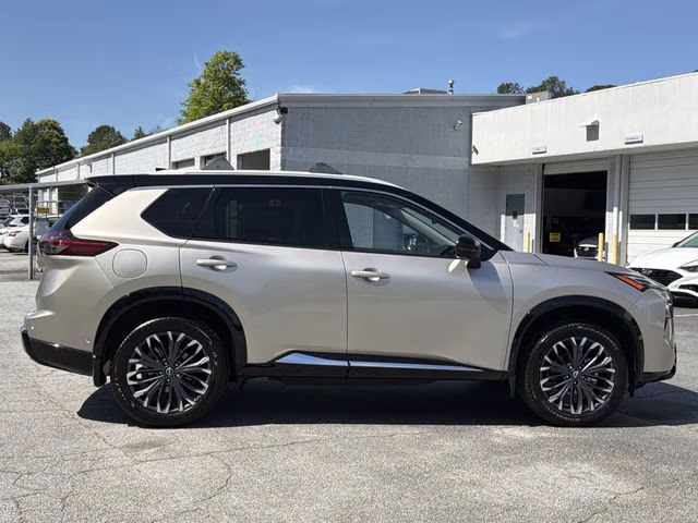 2025 Champagne Silver Metallic/Super Black Nissan Rogue Platinum FWD SUV