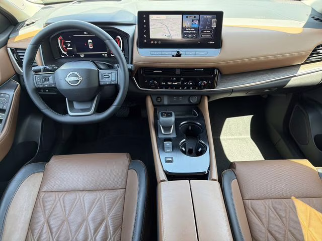 2025 Champagne Silver Metallic/Super Black Nissan Rogue Platinum FWD SUV