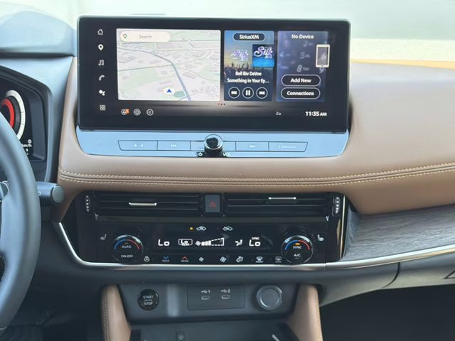 2025 Champagne Silver Metallic/Super Black Nissan Rogue Platinum FWD SUV